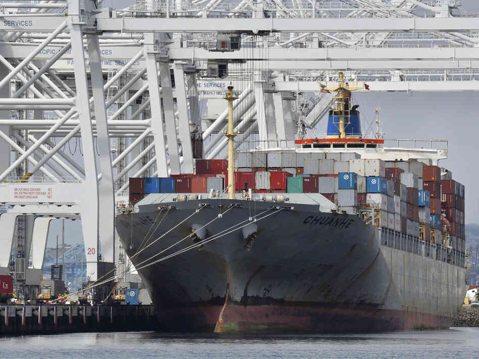 A cargo ship stands on Long Beach harbour, California. A cargo ship stands on Long Beach harbour, California.
